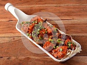 Paneer Manchurian is Indo Chinese cuisine dish, Paneer cubes tossed with tomatoes, onions, spring onions, sesame seeds and soy