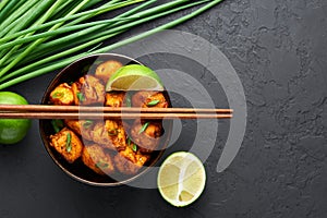 Paneer Manchurian or Paneer 65 in bowl at black concrete background