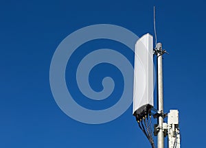 Panel antenna of GSM DCS UMTS LTE bands and radio unit are as part of communication equipment of basic station are photo