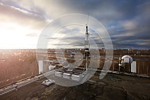 Panel antenna of GSM DCS UMTS LTE bands and radio unit are as part of communication equipment of basic station are installed on photo