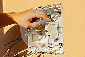 Panel with electrical equipment. The electrician installs circuit breakers. photo