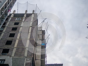 Panel house under construction. Building frame. The safety net is top notch photo