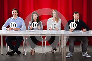 Panel Judges Holding 10 Score Signs