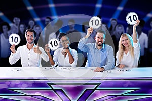 Panel Judges Holding 10 Score Signs