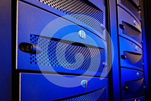 Panel mainframe closeup blue blur server room