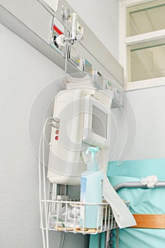 Panel with oxygen and a monitor for measuring contractions, heartbeat in a hospital