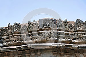 A panel sulpture showing the Jain tirthankara with Yaksha on both the side, Parshvanatha Basadi, Basadi Halli jain temple complex, photo