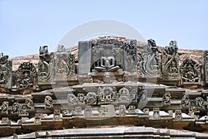 A panel sulpture showing the Jain tirthankara with Yaksha on both the side, Parshvanatha Basadi, Basadi Halli jain temple complex, photo