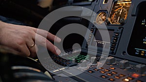 Panel of switches on an aircraft flight deck. Autopilot control element of an airliner. Pilot controls the aircraft