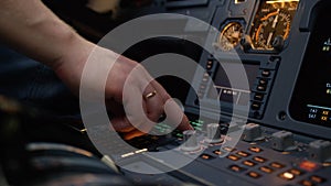 Panel of switches on an aircraft flight deck. Autopilot control element of an airliner. Pilot controls the aircraft