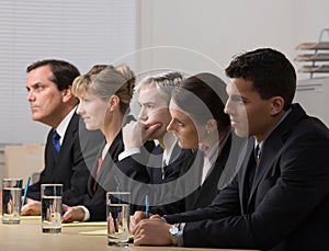 Panel of workers conducting a job interview
