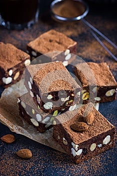 Panforte nero squares . Traditional italian cake with nuts and