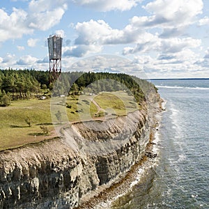 Panga coastal cliff and lighthouse Panga pank, Saaremaa island, near Kuressaare, Estonia. North-Estonian limestone escarpment, photo