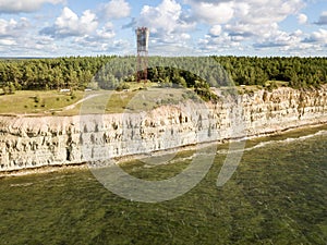 Panga coastal cliff and lighthouse Panga pank, Saaremaa island, near Kuressaare, Estonia. North-Estonian limestone escarpment, photo