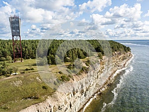 Panga coastal cliff and lighthouse Panga pank, Saaremaa island, near Kuressaare, Estonia. North-Estonian limestone escarpment,