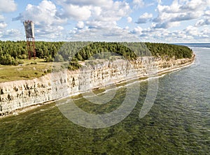 Panga coastal cliff and lighthouse Panga pank, Saaremaa island, near Kuressaare, Estonia. North-Estonian limestone escarpment,