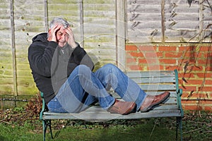 Panic attack man on a bench.