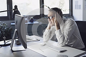 Panicked businessman having issues with his computer