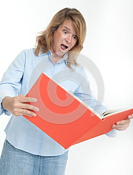 Panicked woman examining a book photo