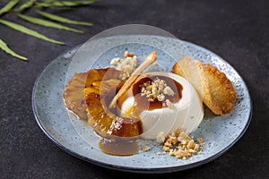Panna cotta with caramelised pineapple and coconut biscuit