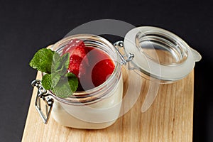 Panna cotta with mint in a glass jar