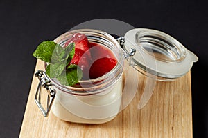 Panna cotta with mint in a glass jar