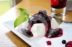 Panna cotta with raspberry jam and mint