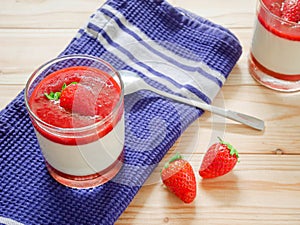 Panna cotta with strawberry coulis and fresh strawberry photo