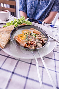 Panned egg on a white dish photo