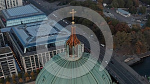 Panning aerial view of city park and buildings on riverbank. View from dome of Berlin Cathedral. Berlin, Germany.