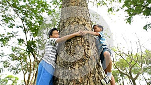 Panning camera, Preteen Asian boy try to hug around