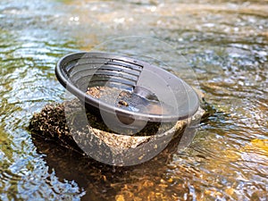 Panning for gold with a pan