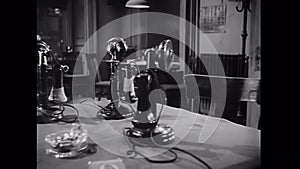 Panning group of old-fashioned telephones on table