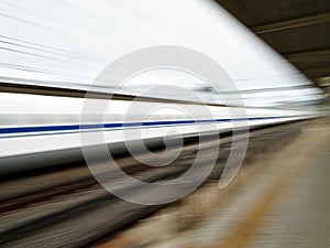 Panning of JR Shinkansen or a bullet train passing at Odawara station