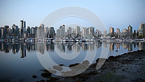 Panning Movie of Vancouver BC British Columbia Canada with Water Reflection at Sunrise One Early Morning from Stanley Park 1080p