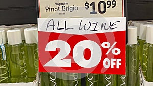 Panning right on a wine sale sign in a retail store in Orlando, Florida