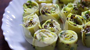 Panning shot of Indian - Gujarati Food named Khandvi