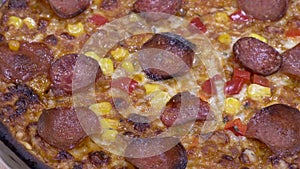 Panning shot over rotating tasty pizza salami