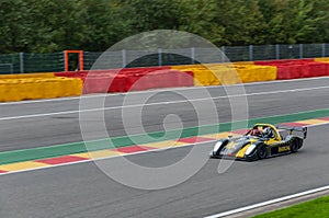 Panning shot of Radical race car on race track