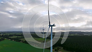 Panning up to reveal Windfarm Turbines