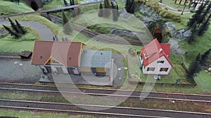 Panning video of diorama with mountain railway and surrounding buildings.