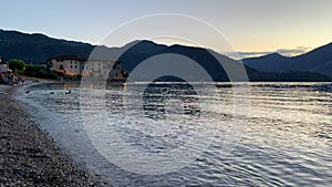 Panning video showing the amazing sunset over Lake Como on summertime