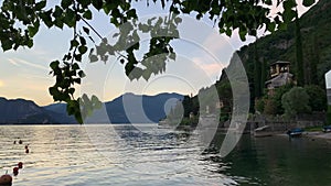 Panning video showing the amazing sunset over Lake Como on summertime