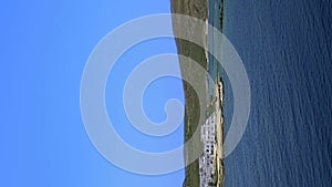 Panning view of Milos island, Greece, on clear sunny day