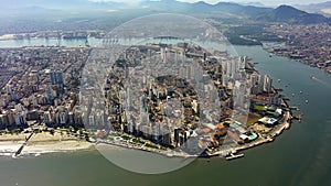 Panning wide landscape of coast city of Santos state of Sao Paulo Brazil.