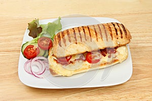 Pannini with garnish on a tabletop