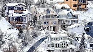 Pano Aerial view of snowy neighborhood in winter on a mountain town with houses