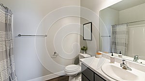 Pano Bathroom interior with wooden flooring and vanity sink