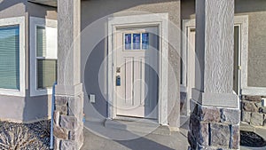 Pano Home with arched entrance to the open front porch and gable roof bay window