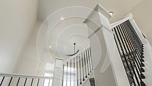 Pano House interior with a view of a staircase and window